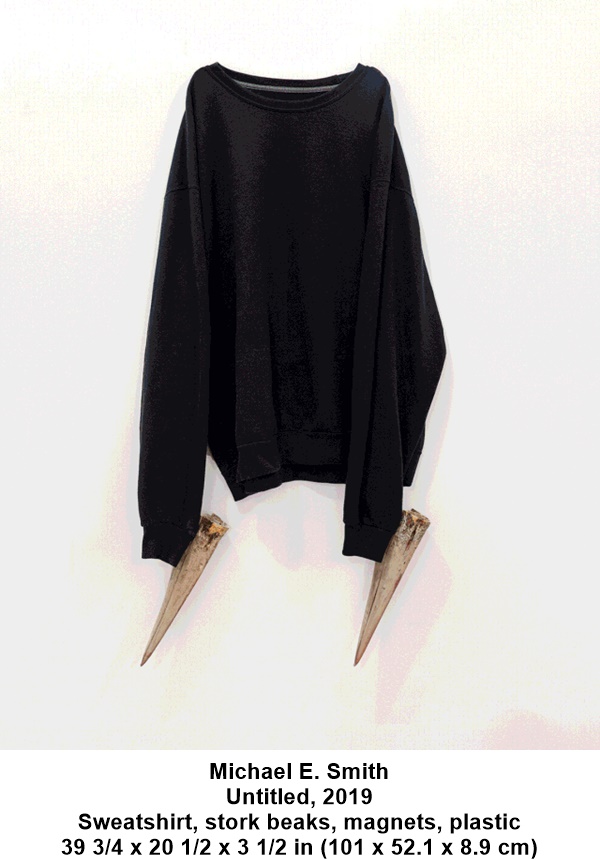 Michael E. Smith
Untitled, 2019
Sweatshirt, stork beaks, magnets, plastic
39 3/4 x 20 1/2 x 3 1/2 in (101 x 52.1 x 8.9 cm)
