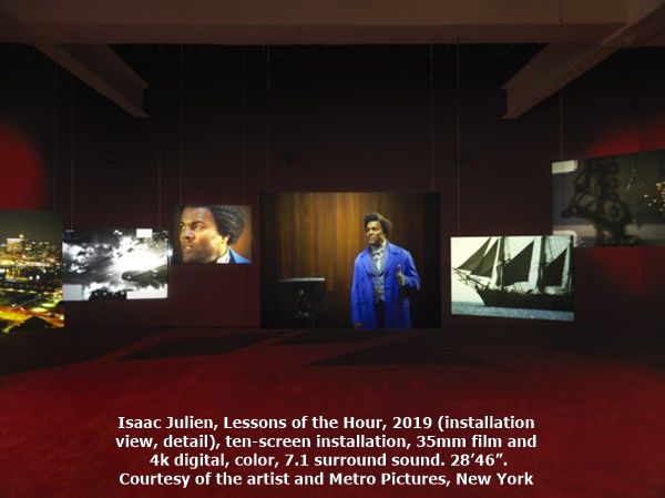 click to enlarge- double click to reduce Isaac Julien, Lessons of the Hour, 2019 (installation view, detail), ten-screen installation, 35mm film and 4k digital, color, 7.1 surround sound. 28’46”. Courtesy of the artist and Metro Pictures, New York